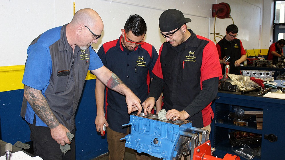 Students learning engine diagnostics at PCC