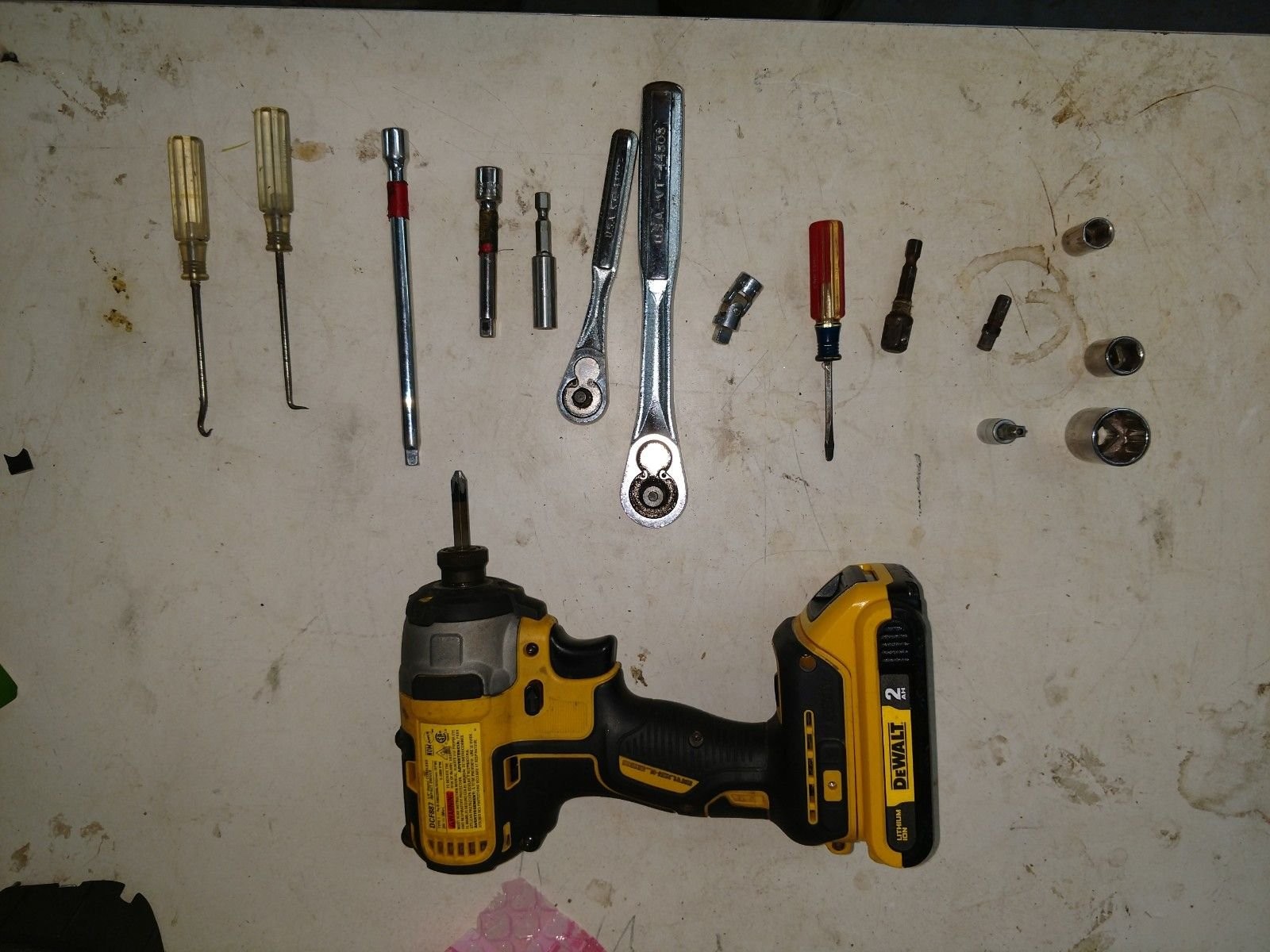 Various pry tools and socket wrenches used for car dashboard removal