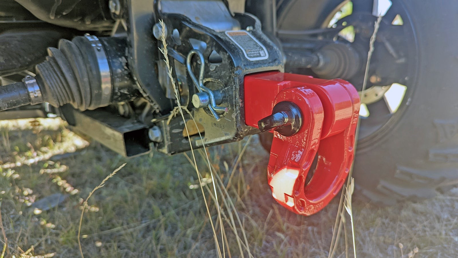 Hitch receiver recovery point attached to a vehicle, ready for shackle connection.