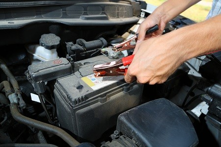 Checking battery terminals for corrosion and loose connections